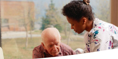 care worker with elderly man