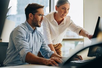 Man and woman at desk