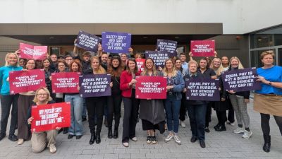 ETUC Women Committee members hold banners with trade union demands for Women's Rights