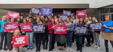 ETUC Women Committee members hold banners with trade union demands for Women's Rights